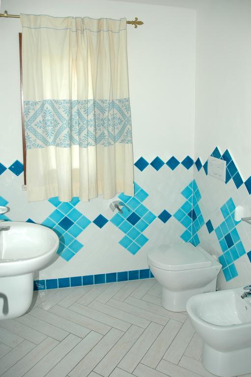 Holiday Homes Stella Marina San Teodoro  Rum bild